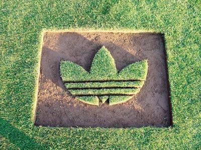 Grass cut to form an Adidas logo