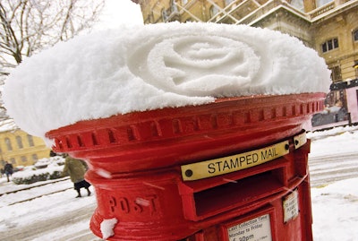 A logo for sports company Extreme stamped into snow.