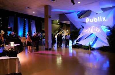 Draping, spandex decor accents, and blue lighting decorated the lobby for the cocktail reception.