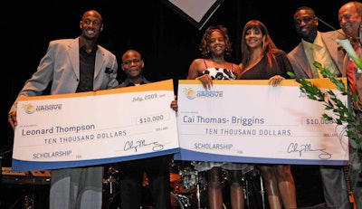 Dwayne Wade, Publix vice president Bill Fauerbach, and Alonzo Mourning and his wife, Tracy, presented checks for $10,000 to the winners of the Publix Student of the Year award.
