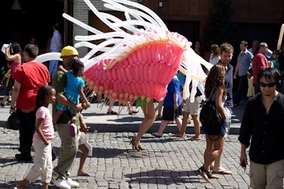 Balloon artist Jason Hackenwerth constructed sculptures and costumes resembling flowers and giant insects.