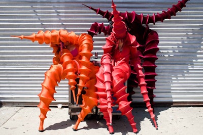 Walking on stilts, and dressed in alien costumes, a troupe from Alice Farley Dance Theater meandered through the crowd, charming some children and spooking a few others.