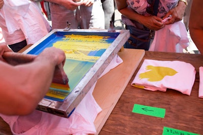 Silk-screen artists took images by artist Michael De Feo and made them into customized T-shirts for guests.
