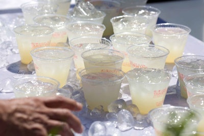 Cups of gratis lemonade came from the world's largest lemonade stand, a 1,300 gallon custom-built Rosenwach water tank.