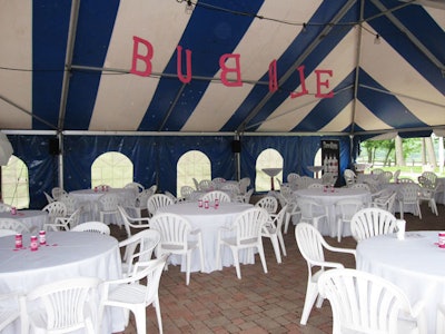 In the tent, hanging letters spelled out the word 'Bubble' and bottles of bubble solution decorated lunch tables.