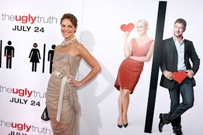 Katherine Heigl, star of The Ugly Truth, posed in front of her likeness at the premiere at the ArcLight, which was followed by a party at Boulevard3 in Hollywood.