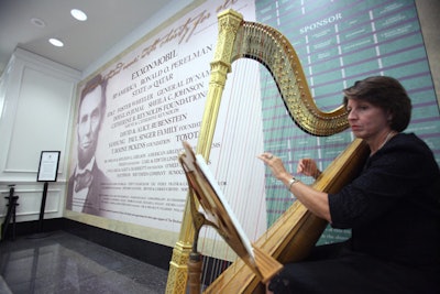 During the champagne reception, harpist Caroline Gregg played in the new lobby, where guests entered and picked up name tags.