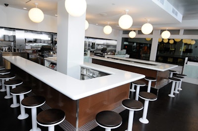 A contemporary take on the classic lunch counter, a sleek white counter dominates Sportello's minimalist space.