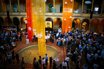 The center fountain area included orange and gold drapery hung with white goldfish-shaped cutouts, mimicking a Zen garden pond.