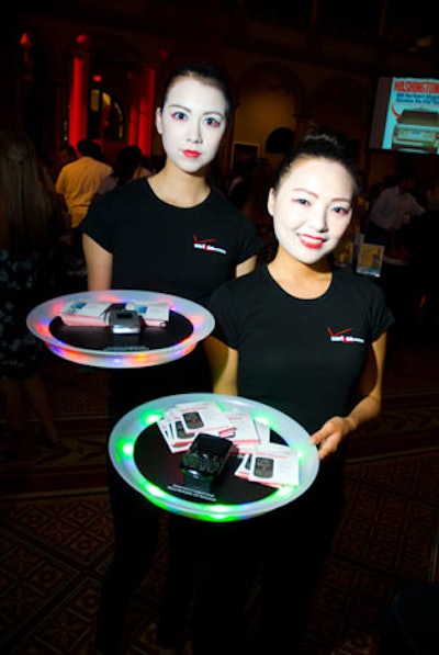 Verizon staffers, wearing Japanese kabuki-style makeup, walked around the event with phones on glow platters.