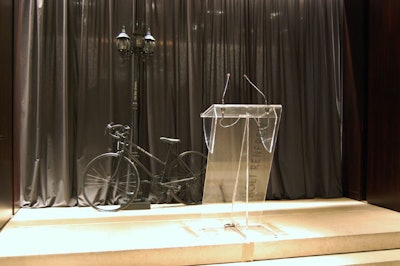 A bicycle and vintage street lamp provided a backdrop for the podium where Scott Schuman answered questions from the audience.