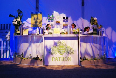 Room Service Furniture and Event Rentals provided the Patron-sponsored bar filled with sand, limes, and bottles of the spirit in the main welcome tent located on 18th Street.
