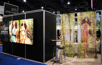 Australian designer Jessika Allen contracted BoothMaster, with offices in Pennsylvania and Las Vegas, to construct her black-boxed booth adorned with sheer drapes printed with her logo and a bikini photo.
