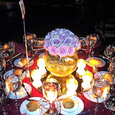 Distinctive Floral Design provided the simple lavender rose centerpieces in fish bowls.