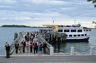 For the invite-only presidents' dinner, boats transported guests to the John F. Kennedy Library & Museum.