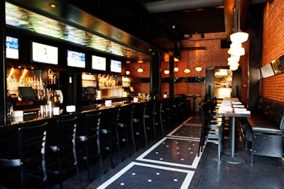 Essex Public House has black chairs and high tables.