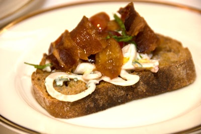 Chef Brian Huston of the Publican topped toasted bread with marinated mackerel, cherries, lovage, and bacon.