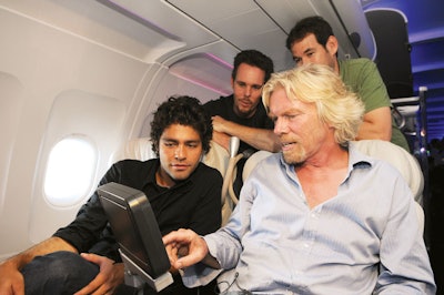 Richard Brandson (right) showed Entourage cast members the plane's entertainment system.