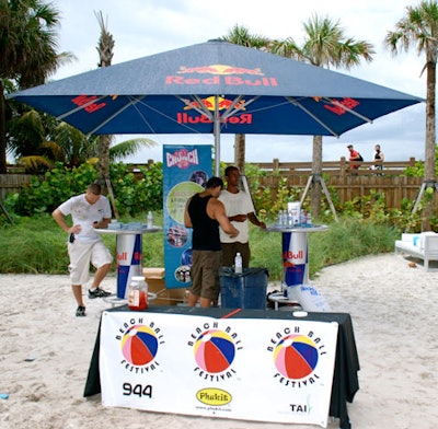 Red Bull, a first-time sponsor, provided branded umbrellas, highboys, and a DJ booth.