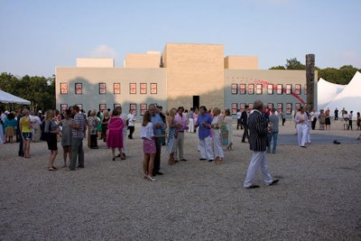 The Watermill Center, a gravel- and canopy-covered canvas. Note the devilish displays on the building walls, as well as the paper airplanes made by the kid artistes.