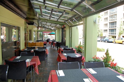 The covered outdoor patio has both air conditioning and heating and seats 50.