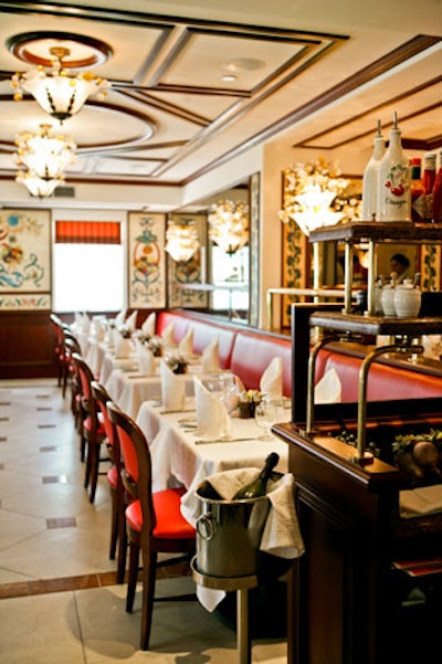 Au Pied de Cochon has colorful murals reminiscent of the paintings at its original location in Paris.