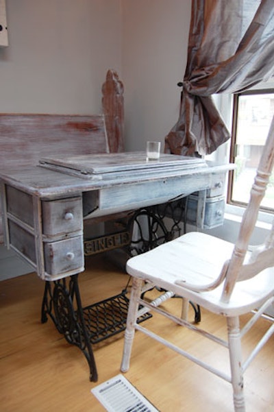 Vintage Singer sewing machines double as tables in the main space at Swirl Wine Bar.