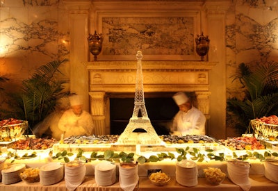 At the premiere party in the Metropolitan Club, a raw bar filled with jumbo shrimp, clams, oysters, and crab claws was decorated with an elaborate Eiffel Tower ice sculpture.