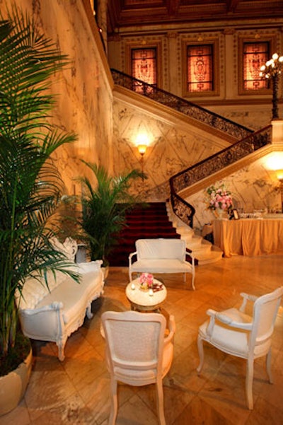Potted palm trees and ornate furniture evoked the film's French embassy setting.