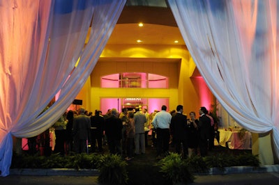Since the lobby of the building was too small for the expected number of attendees, Fernandez draped the carport in sheer white fabric.