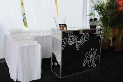 Ronen Bar and Furniture provided mirrored bars decorated with black and white floral decals.