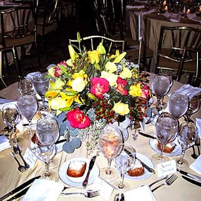 Andrew Pascoe Flowers put together centerpieces of roses and lilies.