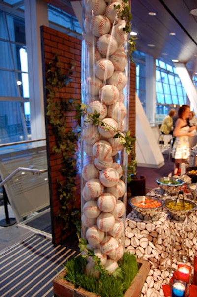Baseballs and a replica of Wrigley Field's ivy-covered brick wall decorated a station devoted to hot dogs.