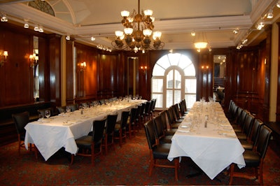 The wood-paneled dining room on the second floor seats 80.