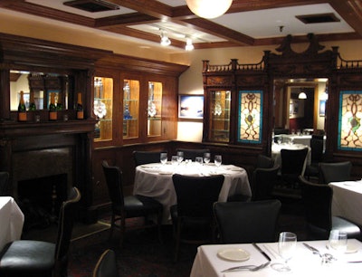 Steps down from the street-level bar, there is a 25-seat dining room with antique woodwork and a working fireplace.