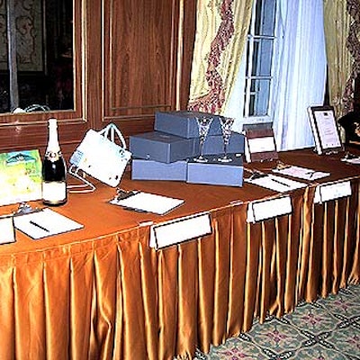 The tables holding silent auction items were covered in copper-colored tablecovers.