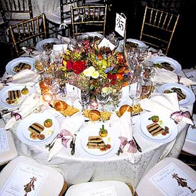In the ballroom, the colorful centerpieces included roses, ranunculus, hyacinth and hydrangea.
