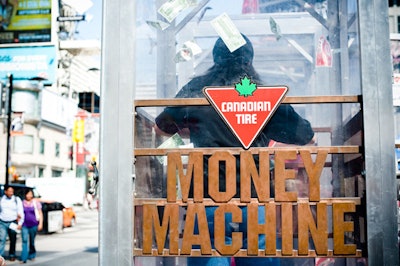 'Money Machines' gave attendees a chance to grab Canadian Tire money in a wind-blown booth.