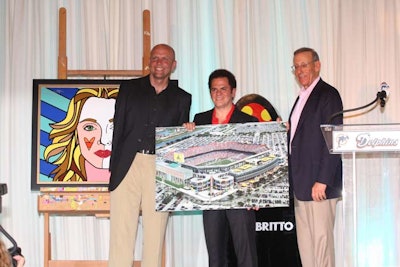 Miami Dolphins owner Stephen Ross (right), accompanied by C.E.O. Mike Dee (left), announced Romero Britto (center) would decorate the entrances of the team's stadium as part of a three-year project.