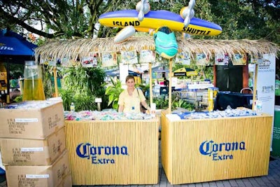 At the Corona booth, representatives distributed branded items, such as beverage koozies.