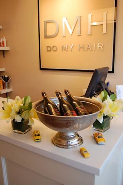 Toy cars surrounded a silver bowl filled with bottles of Jackson-Triggs Cuvée.