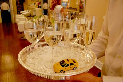 Toy taxi cabs topped trays of champagne.