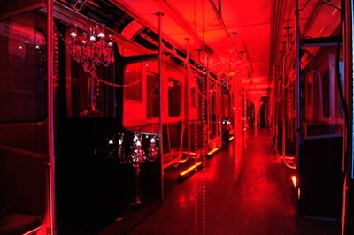 The interior of the 'Pop' car, which Broadbent wrapped up like a shipping crate, was filled with red lighting, chandeliers, and crystal beads.