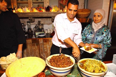 The selection from Radouane Eljaouhari's Mediterranean and Moroccan restaurant Zerza included couscous, caramelized onions, and an eggplant dip with pita.