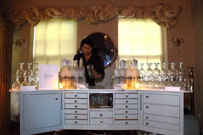 Using a pretty cabinet, sponsor Belvedere Vodka's bar blended in with the venue's overall look.