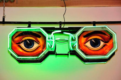 The event took place at Ravenswood Billboard Factory, a sprawling structure that holds vintage ephemera such as a lit-up eyeglasses ad.