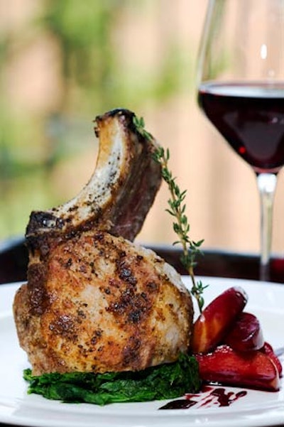 The menu will offer a double-cut pork chop with mustard greens and poached lady apples.