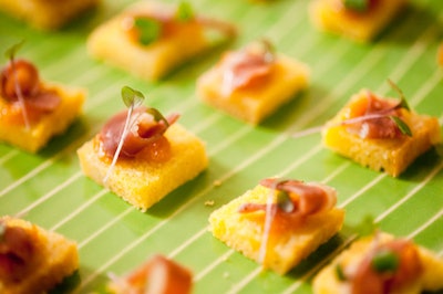 Servers passed duck-proscuitto corn bread hors d'oeuvres to guests.
