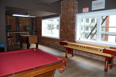 The game area has tables for Foosball, billiards, and shuffleboard.