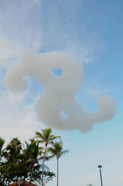 Deco AV sent dollar sign-, heart-, and M.P.I.-shaped flogos into the sky from its location by the boardwalk connecting the Eden Roc and Fontainebleau hotels.